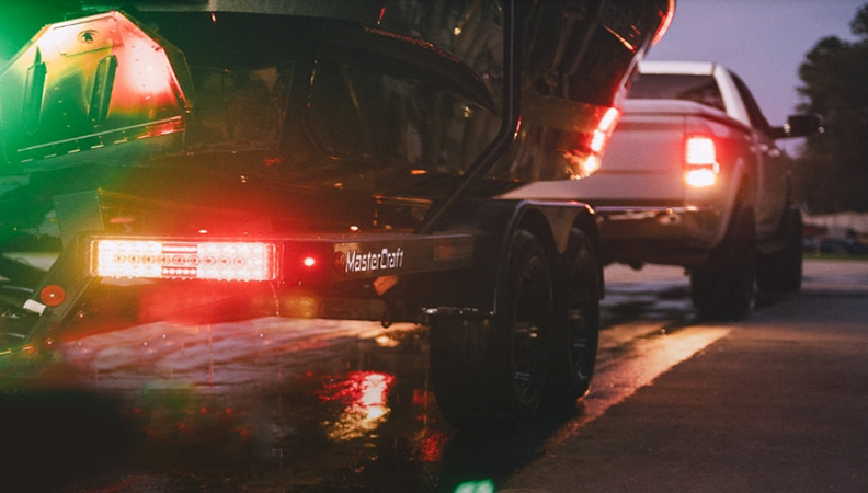 Trailer lights behind a white truck