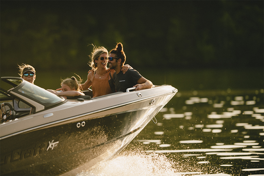 A couple enjoys the sunset on the bow of the XT25