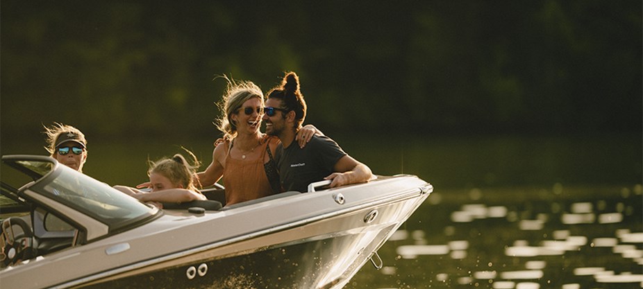 A couple enjoys the sunset on the bow of the XT25